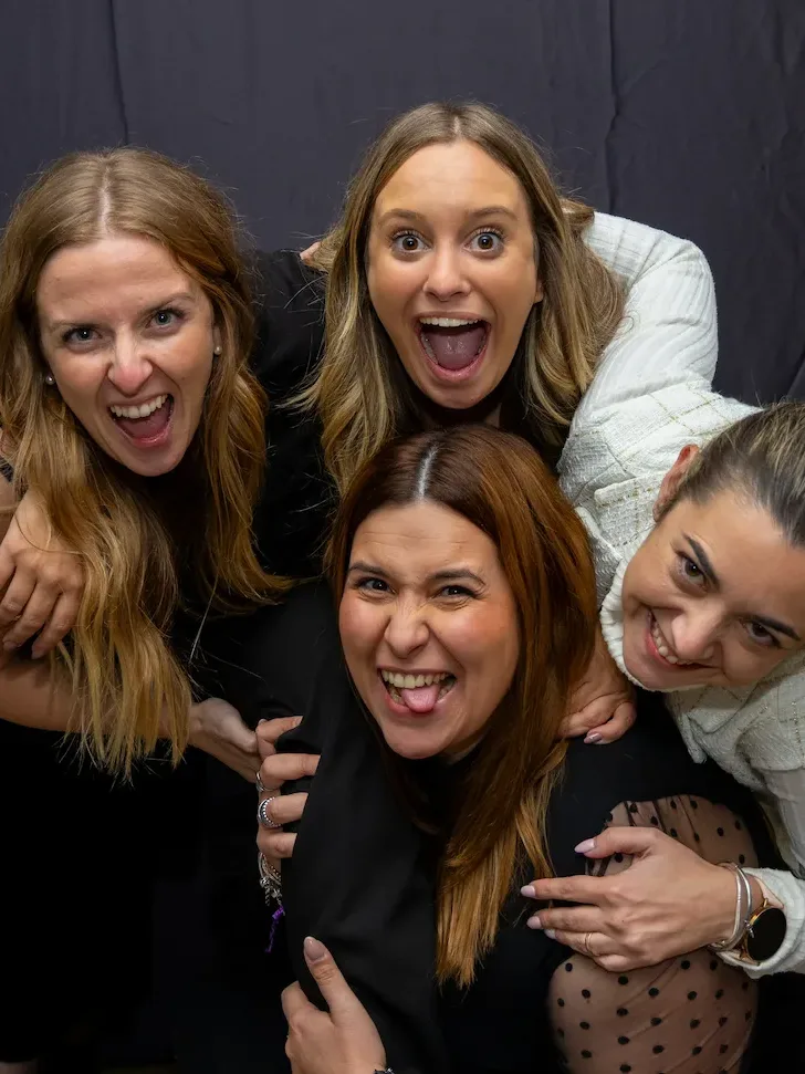 happy group of four women together